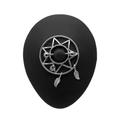 Star-Patterned Silver Nipple Shield and Feather Dangles On Display