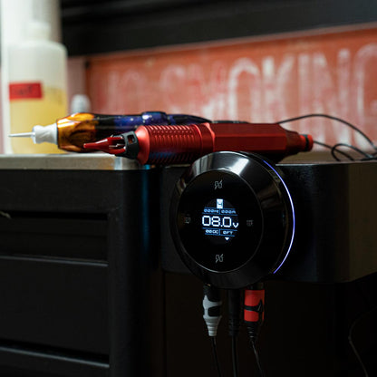 FK Irons Hover Touchless Tattoo Power Supply set up with two machines in focus