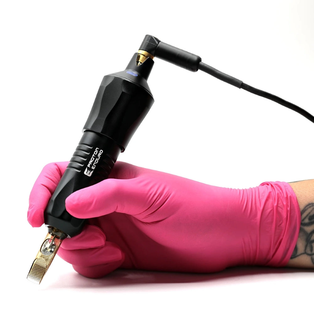 Kwadron Equaliser™ Proton Enduro Rotary Pen Tattoo Machine (in gloved hand with cartridge and RCA cable)